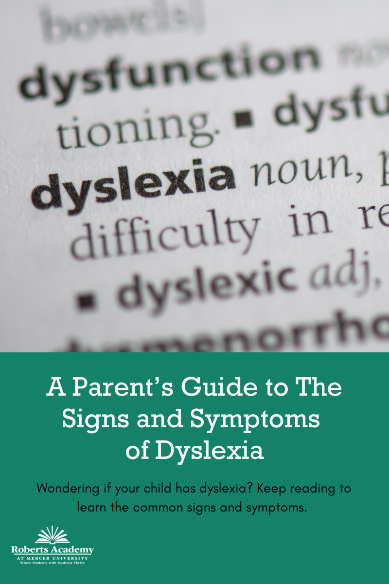 Image: a photo of the definition of dyslexia. Text: A Parent's Guide to The Signs and Symptoms of Dyslexia. Wondering if your child has dyslexia? Keep reading to learn the common signs and symptoms. 