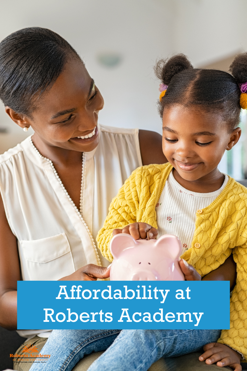 A mother holds a child while they drop coins in a piggy bank. Text on photo reads: "Affordability at Roberts Academy"