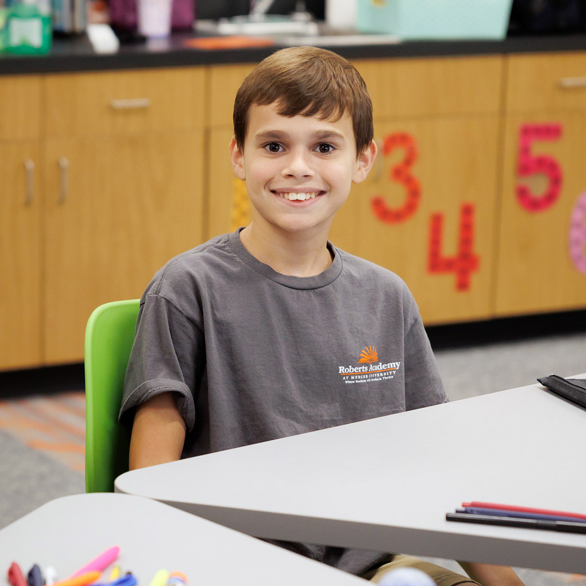 Smiling child in a classroom