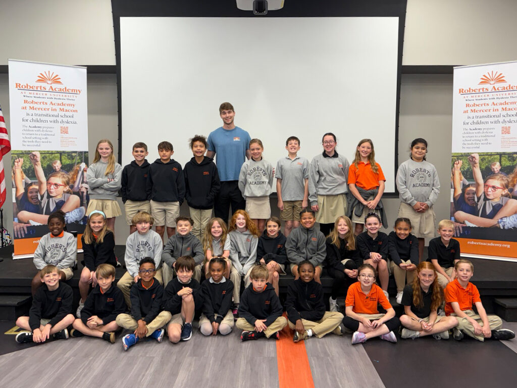 Mercer Chess Club posing with students at Roberts Academy