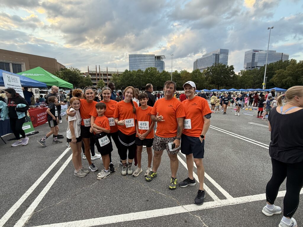 Roberts Academy families pose in a parking lot at Perimeter Mall in Atlanta after the 2025 Dyslexia Dash