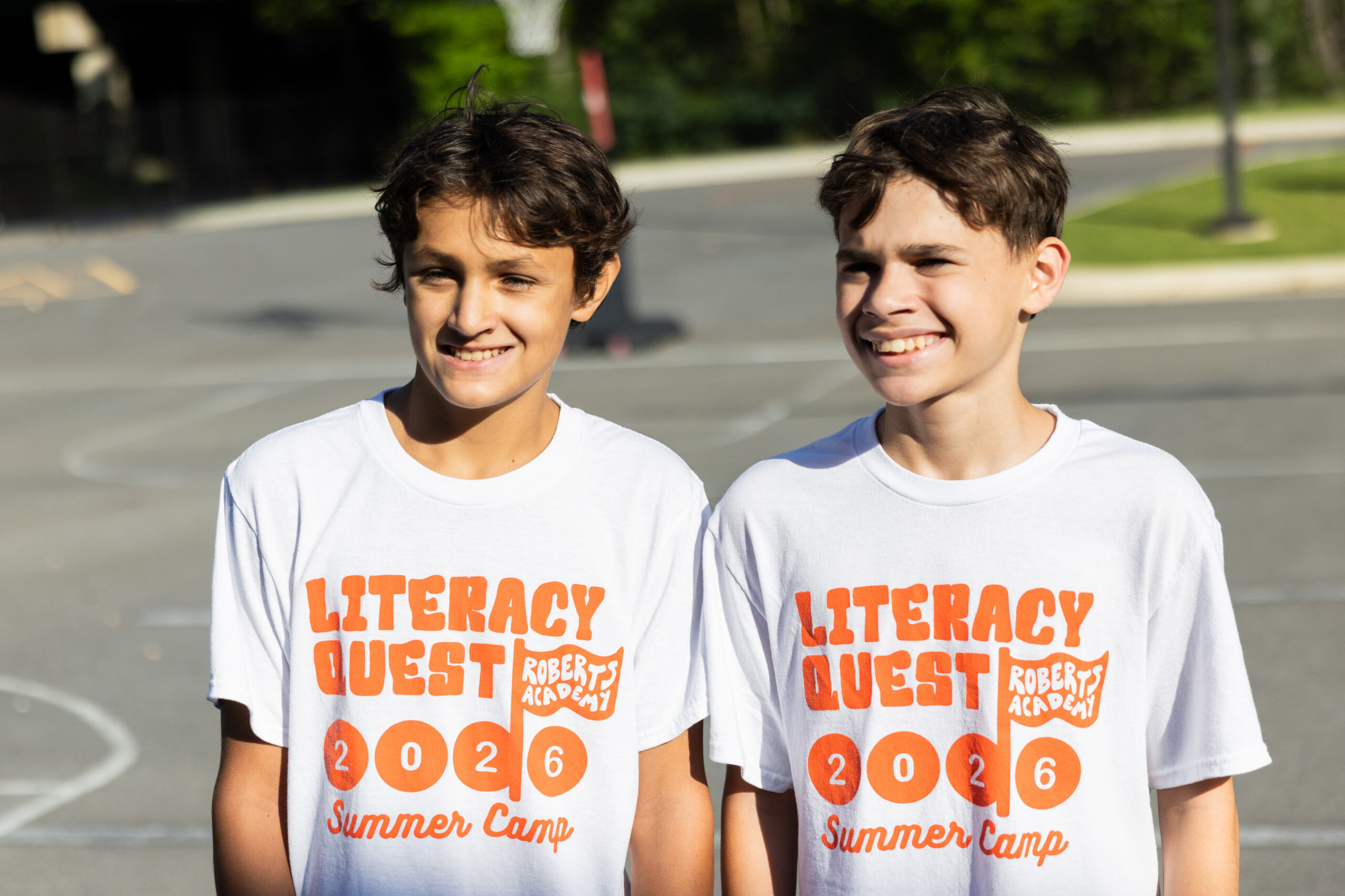 Two Roberts Academy Literacy Quest Summer Camp middle schoolers enjoy time outside