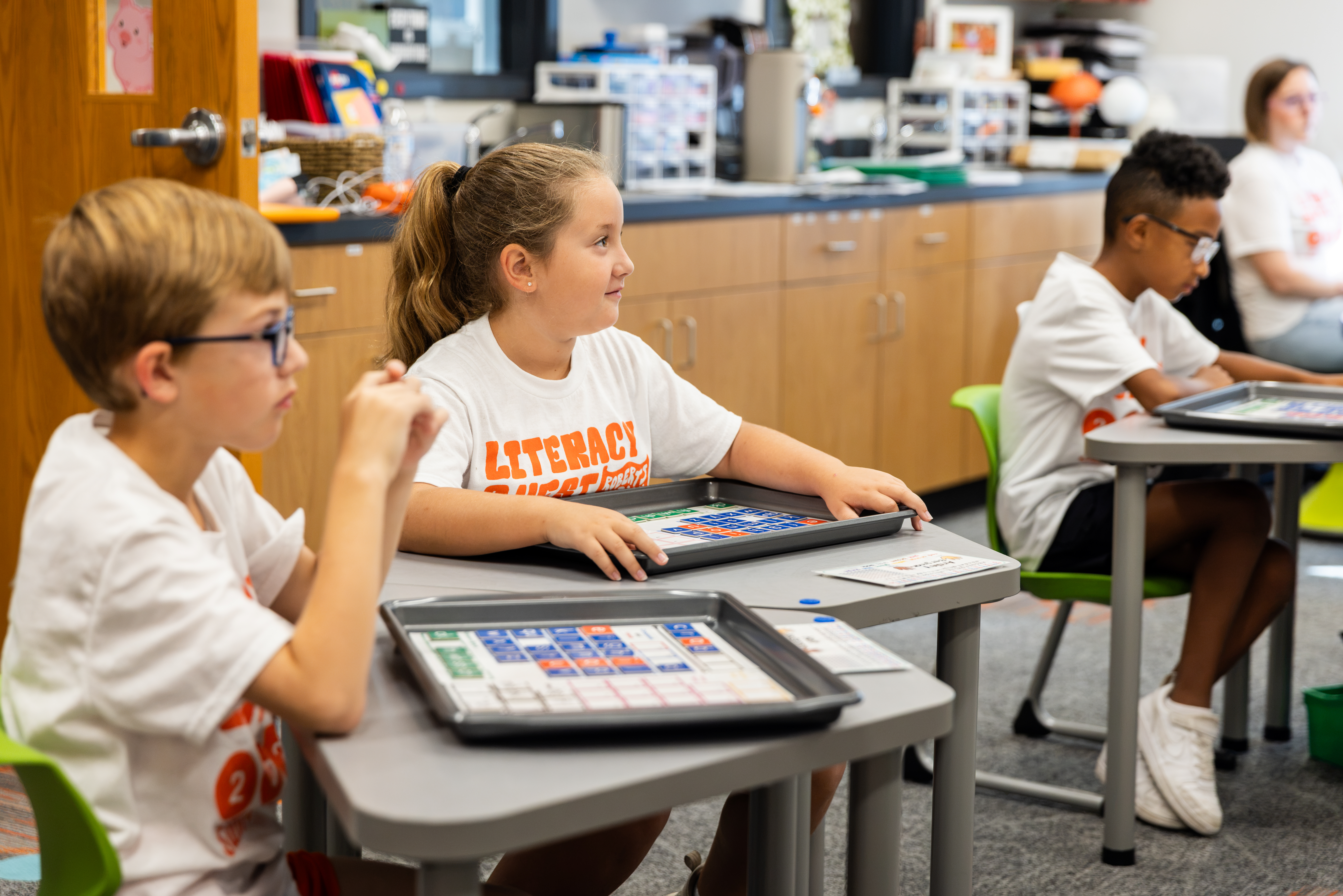 A group of Roberts Academy Literacy Quest Summer Camp campers participate in an Orton-Gillingham lesson.